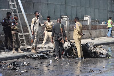 Somali security forces inspect the scene of a car bombing in Mogadishu in September. The attack was blamed on Al Shabab. EPA
