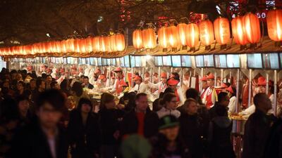Food vendors and customers at a night market in Beijing in China, a city which is one of the locations in Yiyun Li’s latest novel. Tomohiro Ohsumi / Bloomberg / March 2013