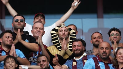A fan wears a nemes inside the stadium ahead of the unveiling of the Egyptian striker. Reuters