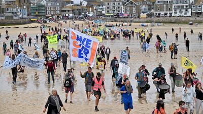 Extinction Rebellion protesters converge on St Ives beach in Cornwall during the G7 summit. Getty