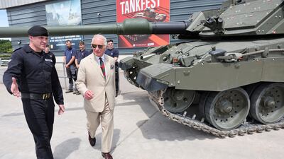 King Charles III views a Challenger III Main Battle Tank during the Royal Tank Regiment's Families' Day at Tank Museum on Monday. Reuters