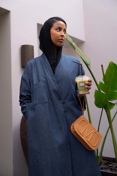 A denim abaya with pockets. Photo: Yalla