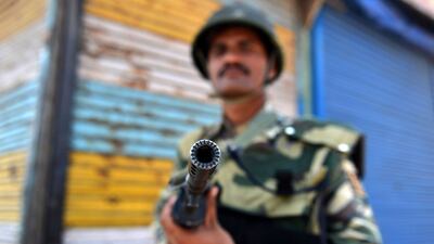 Indian paramilitary troopers stands guard during a curfew in the Batmaloo area of Srinagar on August 17, 2016. Tauseef Mustafa/AFP