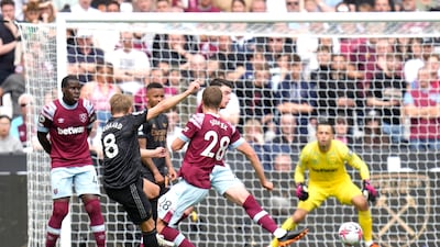 Arsenal's Martin Odegaard trys a shot at goal. AP Photo