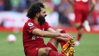 Liverpool's Mohamed Salah on the pitch injured. Reuters