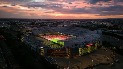 An aerial view of Old Trafford, home of Manchester United FC, all lit up in 2022. The club are considering building a new 100,000-seat stadium. Getty Images