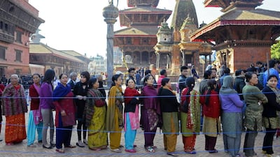 Nepalese queue to cast their ballots at a polling station in Patan on the outskirts of Kathmandu. Prakash Mathema / AFP