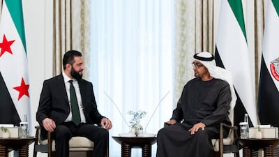 UAE President Sheikh Mohamed talks with Syrian President Ahmad Al Shara in Abu Dhabi on Sunday. Mr Al Shara was making his first trip to an Arab country since forming a new Syrian government last month. UAE Presidential Court
