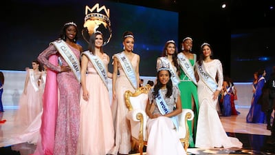 Winner of Miss World 2019, Toni-Ann Singh of Jamaica, front centre, poses for photographers in front of the other finalists, at the 69th annual Miss World competition. AP