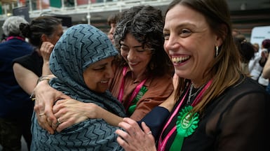 Ifhat Shaheen, left, of the Green Party, celebrates winning one a seat in the ward of Stoke Newington in this week's elections. Getty Images