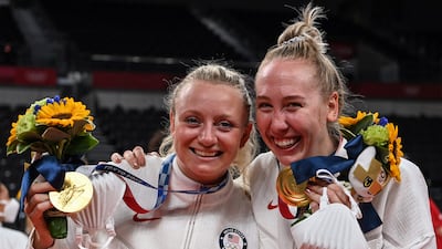 USA's Jordyn Poulter and Michelle Bartsch-Hackley pose with their gold medals during the women's volleyball victory ceremon.