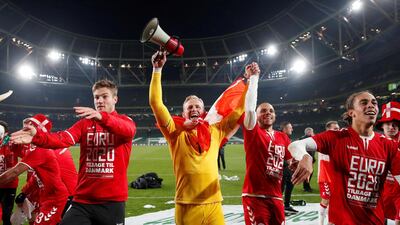 Denmark's Kasper Schmeichel celebrates with Martin Braithwaite and teammates. Reuters