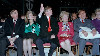 Donald Trump waves to staff members of the Trump Taj Mahal Casino Resort as they cheer him on before the grand opening ceremonies in Atlantic City, N.J. Trump attended the gala with his mother, Mary; father, Fred; and sister, U.S. District Court Judge Maryanne Trump Barry, right. On the left are Donald Trump's brother Robert Trump and his wife, Blaine Trump, April 5, 1990. AP Photo