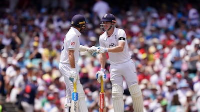 England’s Joe Root, left, and Harry Brook fist bump on day one of the fifth Ashes Test at the Sydney Cricket Ground. PA