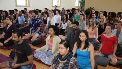 Retreat goers meditating in the IMS Retreat Center meditation hall. AP