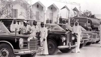 Their vehicles, including a Rolls-Royce that had made the long journey on desert tyres across the sands to the meeting, are also shown.