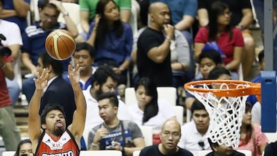 Manny Pacquiao takes a jumpshot during warmups on Sunday before Kia-Sorento's game against Blackwater-Elite in the PBA. Dennis M Sabangan / EPA