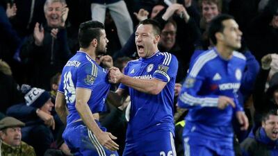 Chelsea's Diego Costa, left, celebrates scoring with captain John Terry, center, during their English Premier League match against Manchester United at Stamford Bridge in London, Sunday, Feb. 7, 2016. (AP Photo/Tim Ireland)