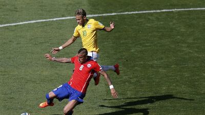 Brazil's Neymar fights for the ball with Chile's Arturo Vidal during their 2014 World Cup last-16 match on Saturday in Belo Horizonte, Brazil. Leonhard Foeger / Reuters