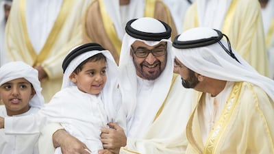 Sheikh Mohammed bin Rashid, Vice President and Ruler of Dubai, with Sheikh Mohammed bin Zayed, Crown Prince of Abu Dhabi and Deputy Supreme Commander of the Armed Forces, at a wedding for Al Nahyan and Al Qasimi family members. With them are Sheikh Tahnoon bin Mohammed bin Tahnoon Al Nahyan, on Sheikh Mohammed’s knee, and Sheikh Zayed bin Mohammed bin Hamad Al Nahyan at Mushrif Palace. Ryan Carter / Crown Prince Court – Abu Dhabi
