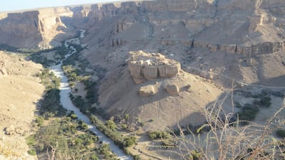 Haid Al-Jazil sits on a large rock in the middle of a long valley. Courtesy Saeed Al-Batati