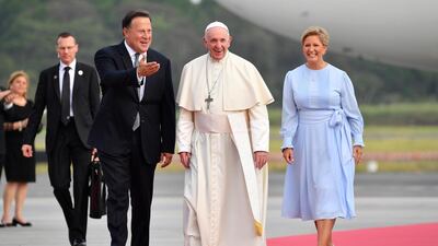 Pope Francis is welcomed by the Panama's President Juan Carlos Varela and his wife Lorena Castillo. EPA