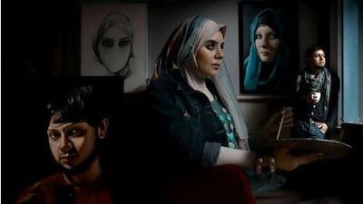 Iythar, an Egyptian-British fine artist, paints at her studio in east London. Bharat Choudhary