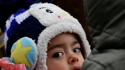 A migrant girl from Afghanistan arrives at the village of Skala Sikaminias, on the Greek island of Lesbos, after crossing the Aegean from Turkey, on Friday, February 28, 2020. AP