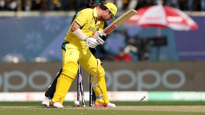 Travis Head of Australia is bowled out by Glenn Phillips of New Zealand. Getty Images