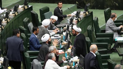 Iranian parliament members attending a meeting in the capital Tehran. Iran's parliament speaker Mohammad-Bagher Ghalibaf said today that any negotiations with the United States would be "futile" as he delivered his first major speech to the conservative-dominated chamber. AFP