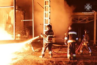 Firefighters tackle a blaze at energy infrastructure facilities in Ukraine after a Russian drone attack. Reuters