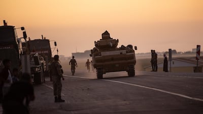 People wave as Turkish soldiers prepare to cross the border into Syria on October 09, 2019 in Akcakale, Turkey. Getty Images