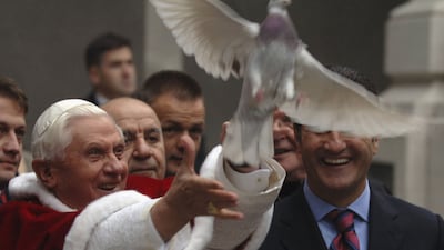 Pope Benedict XVI frees a dove during a visit to the Holy Spirit Cathedral in in Istanbul in December 2006. Getty Images