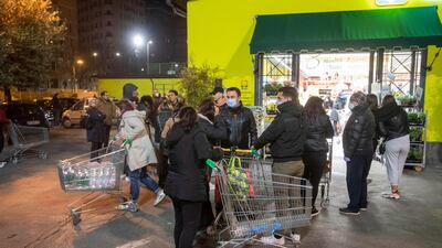 Roman citizens go to buy groceries at a supermarket in Rome, Italy. EPA