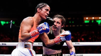 Katie Taylor punches Amanda Serrano during the sixth round. AP