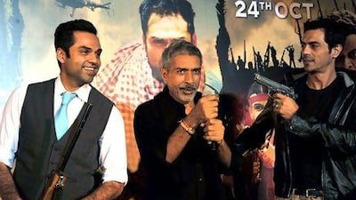 From left, actor Abhay Deol, director Prakash Jha and actor Arjun Rampal at the unveiling of Chakravyu. AFP