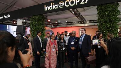 India's Environment Minister Bhupender Yadav, centre, stands in front of the country's pavilion on the first day of the Cop27 climate conference in Sharm El Sheikh, Egypt, on November 06, 2022. Getty Images