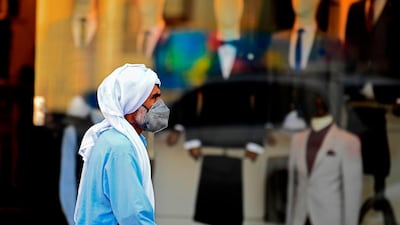 A man walks past a clothing shop in Dubai. AFP