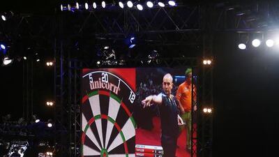Phil Taylor (on screen) playing against Peter Wright in the Dubai Duty Free Darts Masters 2015 at Dubai Tennis Stadium in Dubai. Pawan Singh / The National