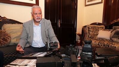 Shaukat displays some of his old cameras.
