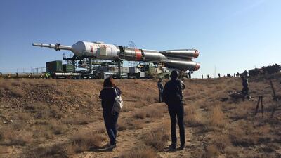 Television crews and relatives of the three astronauts - Hazza Al Mansouri, Oleg Skripochka and Jessica Meir - gather at sunrise to watch the journey to the launch pad. James Langton / The National