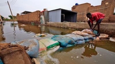 A Sudanese man builds a barricade in Tuti island, where the Blue and White Nile merge. AFP