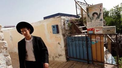 An ultra-Orthodox Jew walks through an alley in Israel's northern town of Safed, where Kabbalah mysticism has its roots.