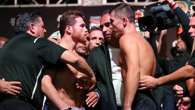 Canelo Alvarez, left, and Gennady Golovkin face off during a weigh-in at T-Mobile Arena in Las Vegas late on Friday. AP Photo
