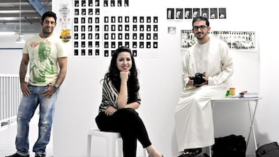 From left, the painter Bilal Aquil, the conceptual artist Rania Jishi and the photographer Ammar Alattar in the Capsule Arts warehouse. Jeff Topping for The National