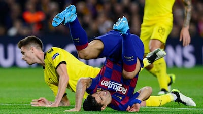 Barcelona forward Luis Suarez goes head-over-heels after a challenge by Dortmund's Julian Weigl. AFP
