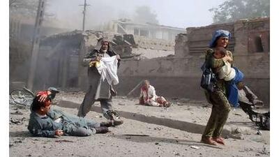 People flee the scene of the suicide attack on the Indian Embassy in Kabul yesterday.