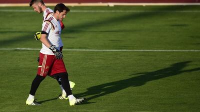 Manchester United's Spanish goalkeeper David de Gea, left, is not going to Real Madrid, and and Porto FC's Spanish goalkeeper Iker Casillas, he formerly of Madrid, does not appear to have his No 1 spot as Spain's goalkeeper in danger. Pierre-Philippe Marcou / AFP