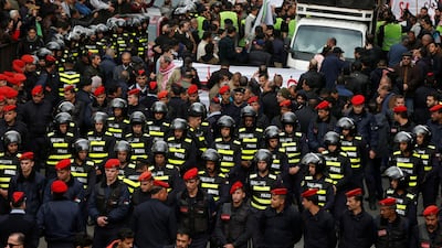 Jordanian police officers walk during a protest against a government's agreement to import natural gas from Israel, in Amman, Jordan. Reuters
