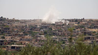 Smoke billows following reported bombardment by government forces in the Syrian northwestern town of Barah, in the Jabal al-Zawiya region of the rebel-held Idlib province on June 21, 2021. AFP